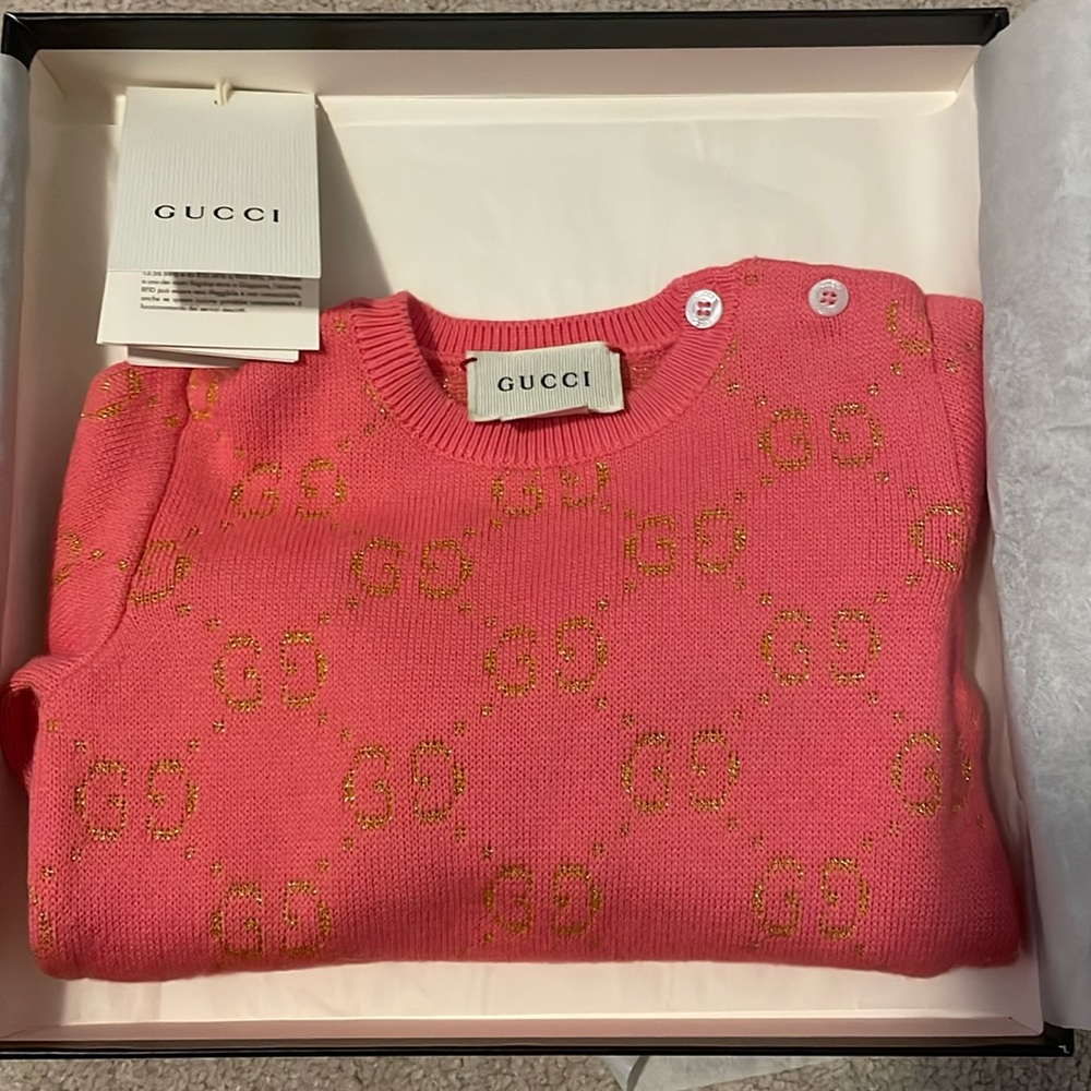 Gucci infant sweater in pink with gold metallic GG logo.  Like new.  Worn twice.